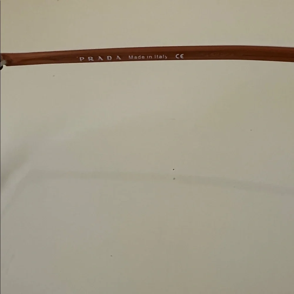 Prada Sleek Bronze Titanium Frameless Rectangular Prescription Glasses Frame